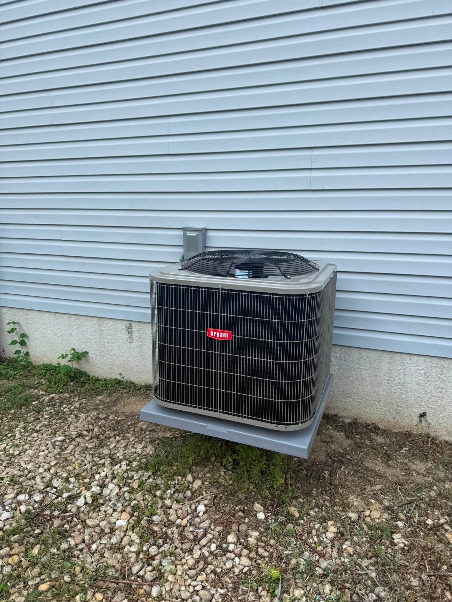 Bryant outdoor unit installed beside a home by LTM HVAC LLC